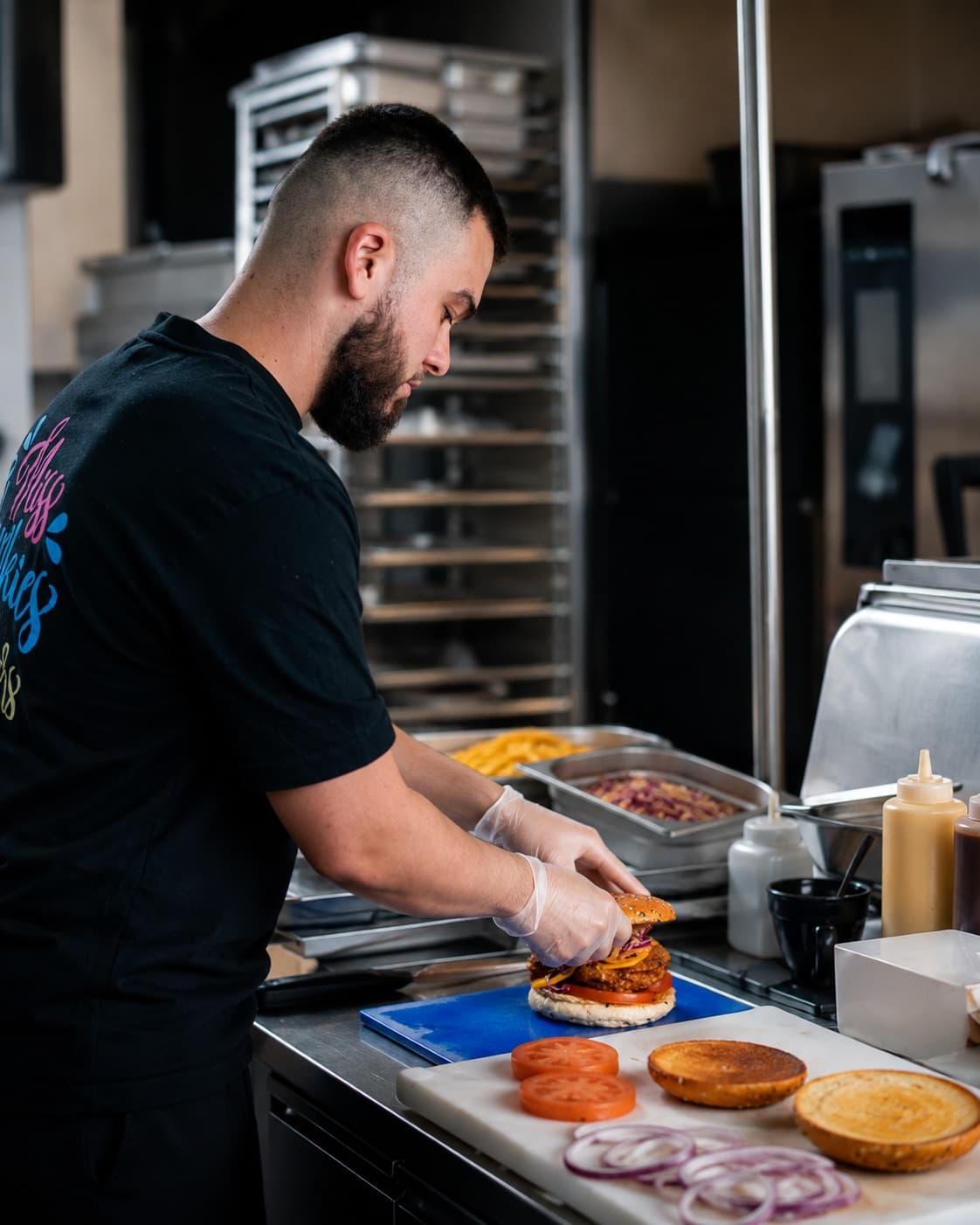 Miss Chunkies chef assembling a signature burger